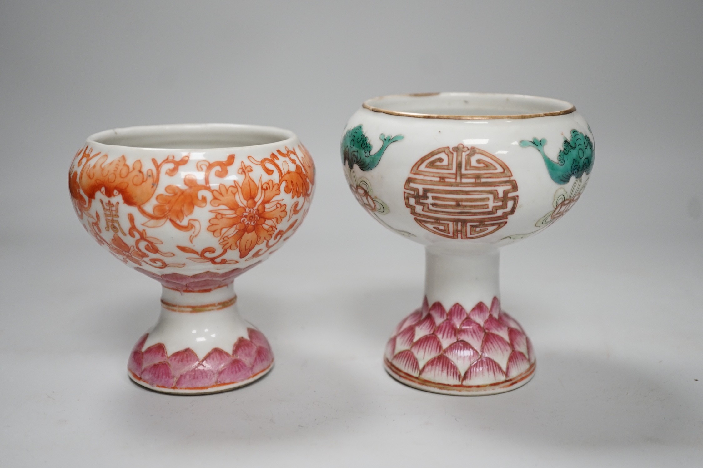 Two 19th century Chinese enamelled porcelain stem bowls, each painted with bats and Shou, the foot with Lotus petals, tallest 11cm
